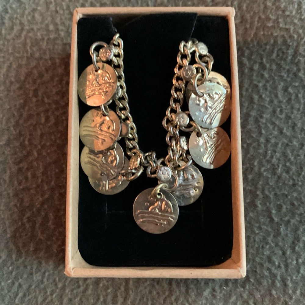 Gold plated coin bracelet. 10 1/2 inches